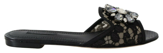 Elegantes mules de encaje negro con detalle de flor joya de Dolce & Gabbana
