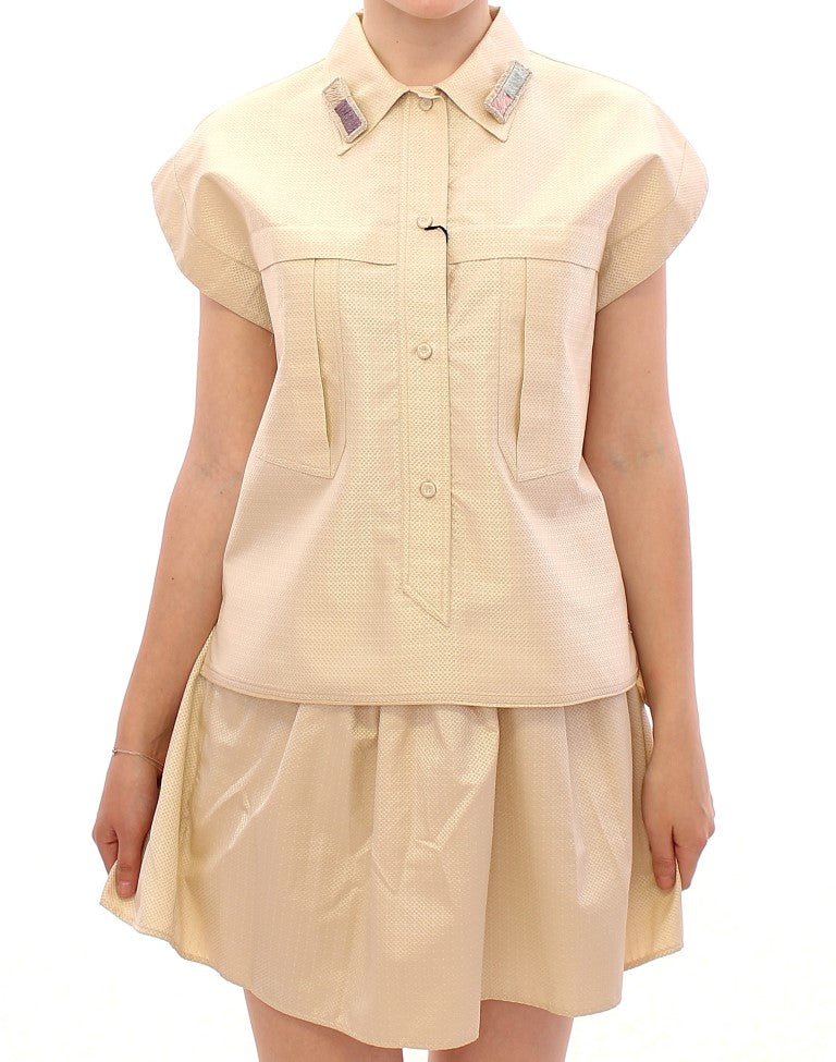 Blusa elegante sin mangas color beige de Andrea Incontri