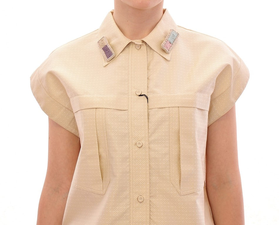 Blusa elegante sin mangas color beige de Andrea Incontri