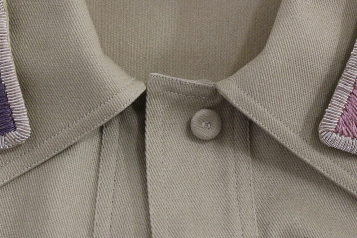 Camiseta sin mangas de algodón beige con broches de Andrea Incontri