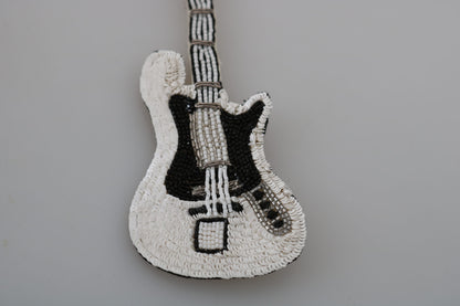 Broche con forma de guitarra y lentejuelas doradas de Dolce &amp; Gabbana