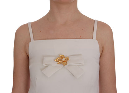 Vestido elegante de lana blanca con broche dorado de Dolce &amp; Gabbana