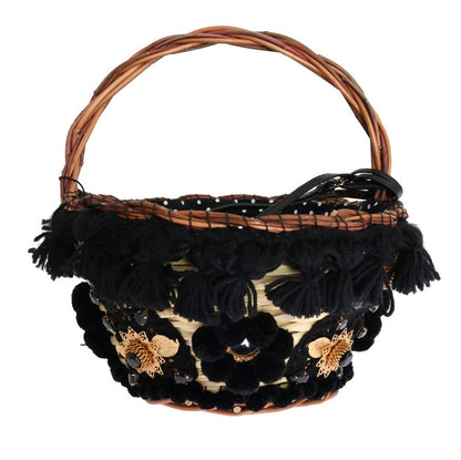 Bolso tipo cubo elegante de piel de serpiente en paja beige y negra de Dolce &amp; Gabbana