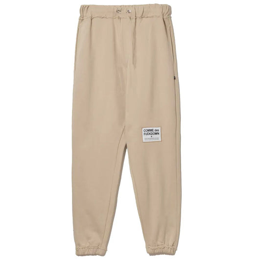 Pantalones deportivos elegantes de algodón beige con detalles deshilachados de Comme Des Fuckdown