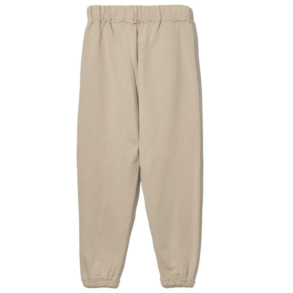 Pantalones deportivos elegantes de algodón beige con detalles deshilachados de Comme Des Fuckdown