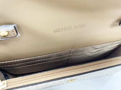 Bolso bandolera con solapa Jet Set Travel de Michael Kors en dorado pálido