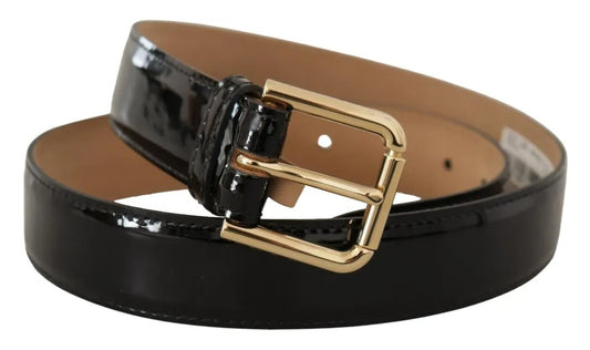 Cinturón de piel de charol negra con hebilla grabada con logotipo dorado de Dolce & Gabbana