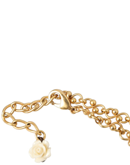 Collar con dije de cristal y corazón sagrado en cadena de latón dorado de Dolce &amp; Gabbana