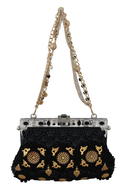 Clutch de noche con cristales barrocos dorados y borlas negras de Dolce &amp; Gabbana