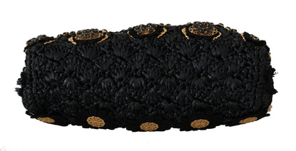 Clutch de noche con cristales barrocos dorados y borlas negras de Dolce &amp; Gabbana